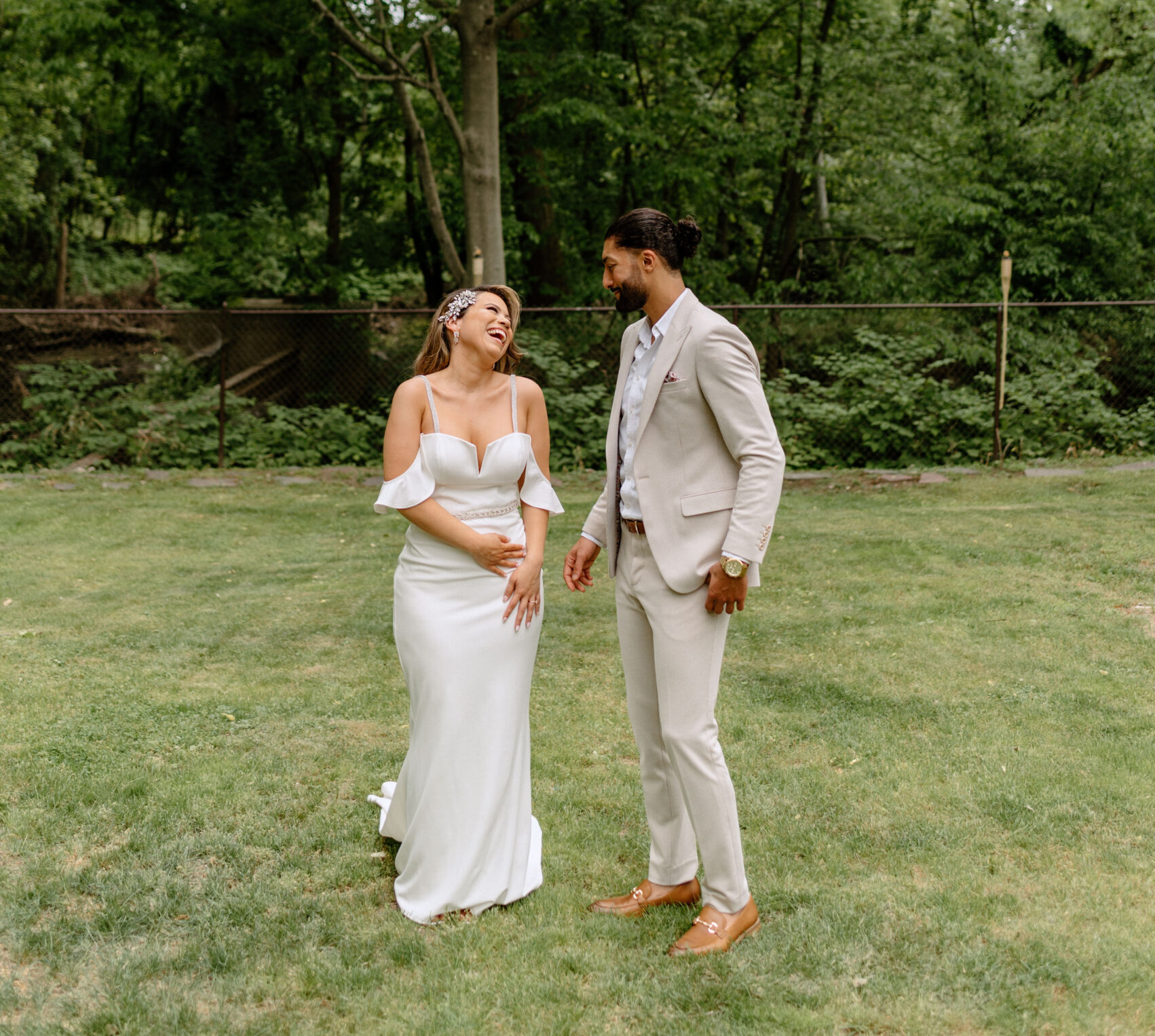 bride and groom smiling at each other right after their first look