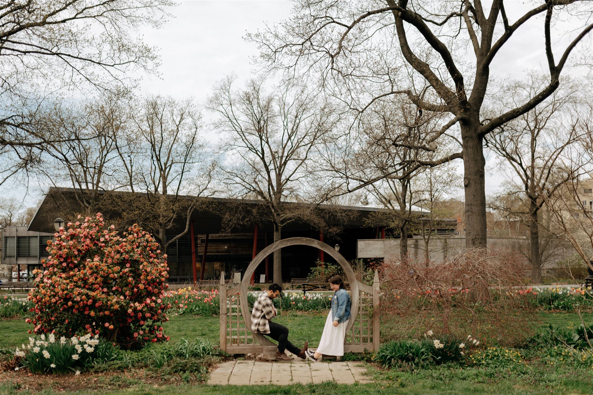 landscape photo of couple existing at the queens botanical garden